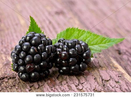Balckberry Fruit Closeup On Old Wood Background