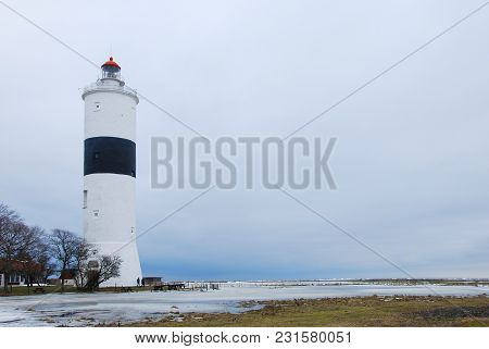 Winter Season At The Ottenby Lighthouse On The Swedish Island Oland In The Baltic Sea. A Famous Bird
