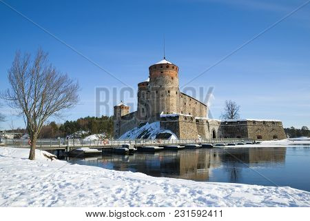 The Ancient Olavinlinna Fortress In The Winter Landscape. Savonlinna, Finland