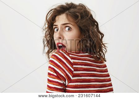 Do Not Sneak Up, You Scared Me. Studio Shot Of Scared Woman Turning Back To Camera, Expressing Shock
