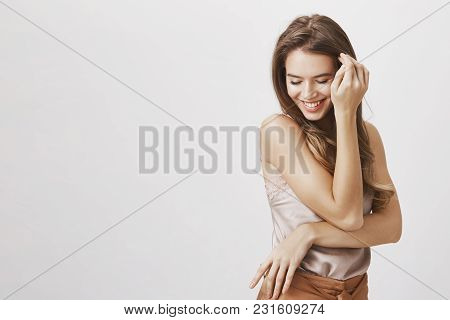 Confident And Tender Female Blushing From Compliments. Portrait Of Flirty Sensual Feminine Woman Tou