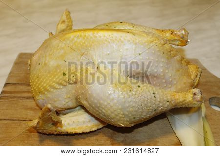 Homemade Stuffed Capon On Wooden Cutting Board