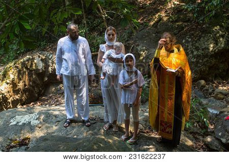 KOH CHANG, THAILAND - MAR 10, 2018: During Christian sacrament of spiritual birth - Baptism. There are currently 10 Orthodox parishes in Thailand, Orthodoxy is practiced by 0.002% of population.