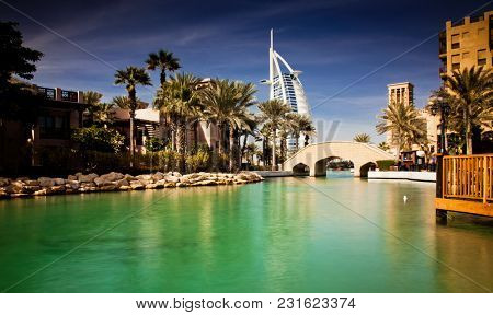 DUBAI, UAE - FEBRUARY, 2018: View on Burj Al Arab, the world only seven stars hotel seen from Madinat Jumeirah, a luxury resort which include hotels and souk spreding across over 40 hectars.