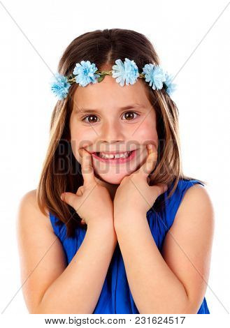 Beautiful small girl with blue dress and a flowersÃÂ´ wreath on her head showing the smile isolated on a white background