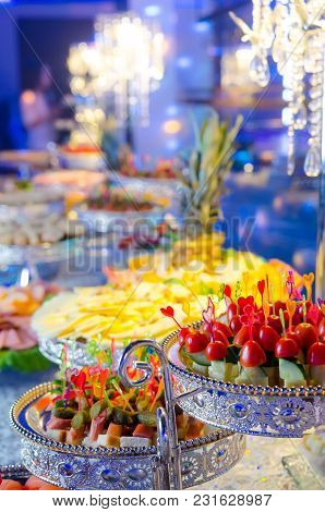 Delicacies And Snacks At A Buffet Or Banquet. Vegetables Snacks: Cucumber, Tomato