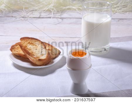 Morning Breakfast Set With Egg, Orange Jam On Bread Toast And Milk In Glass