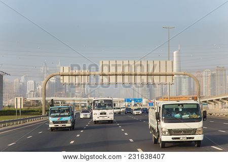 Dubai, Uae February 20, 2018: The Cars And Trucks On The Highway
