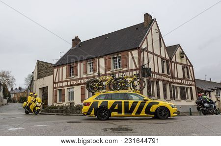 Dampierre-en-yvelines, France - March 4, 2018: The Yellow Technical Car Of Mavic And The Bike Of Lcl