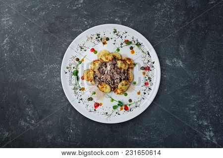 Mushroom Beef Stroganoff, With Champignons And Potato Pancakes, Served On The White Plate With Grey 