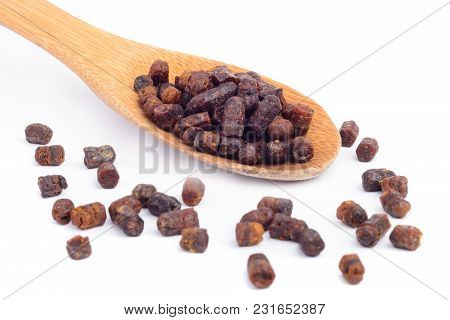 Granules Of Bee Bread In A Wooden Spoon Are Isolated On A White Background. Apitherapy. Beekeeping P