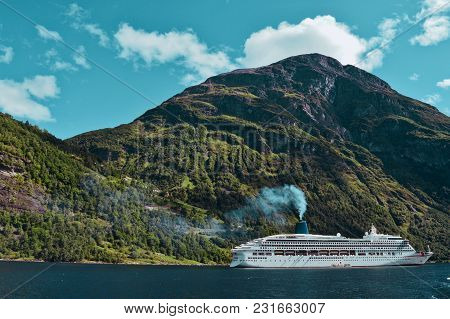 A Big Cruiser Floating In Norway Fjord Geiranger