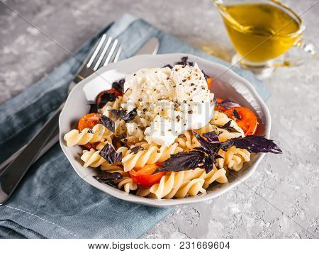Tasty Italian Fusilli Pasta With Cherry, Mozarella Or Buratta Cheese And Fresh Basil. Dish With Past