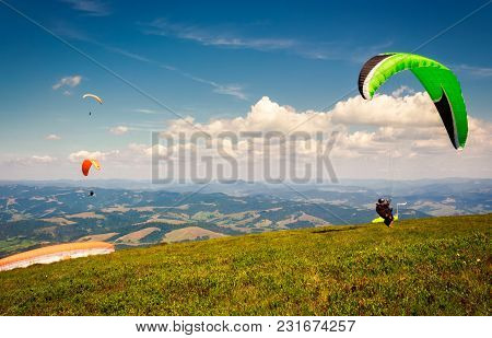 Skydiving  Flying Over The Mountains. Parachute Extreme Sport