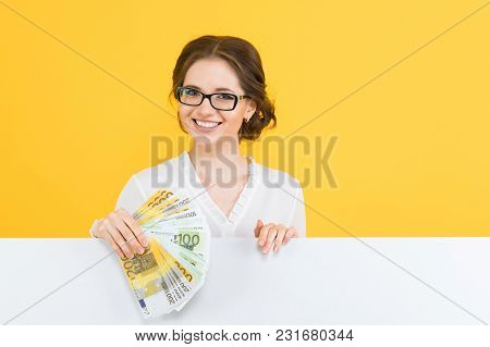 Caucasian Brunette Smiling Attractive Businesswoman In Formal Dress Holding Money In Her Hands Stand