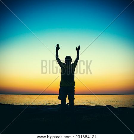 Vignetting Photo Of Man Silhouette Praying At The Sunset