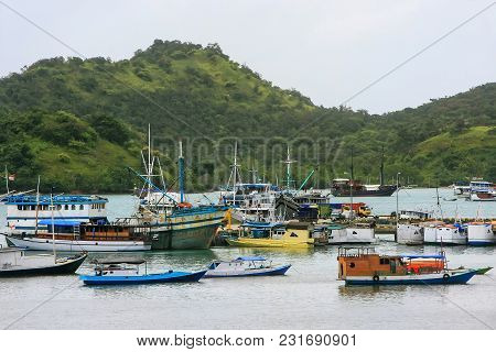 Boats Anchored At Labuan Bajo Town  On Flores Island, Nusa Tenggara, Indonesia. The Local Economy In