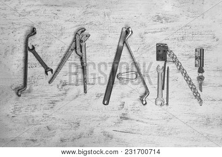 Text Man Is Written By Work Tools. The Word Man Is Made Up Of A Work Tools.