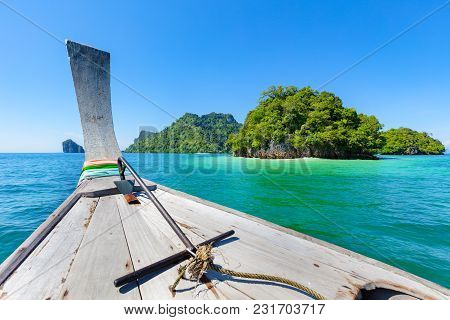 Closeup Of Longtail Boat In Sea During Summer At Aonang Beach Against Blue Sky