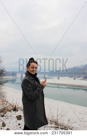 Girl Standing On River Shore And Lookingat The River Neretva In Bosniya And Herzegovina