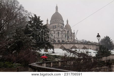The Basilica Sacre Coeur Covered With Snow. It Is A Roman Catholic Church Located At The Summet Of T