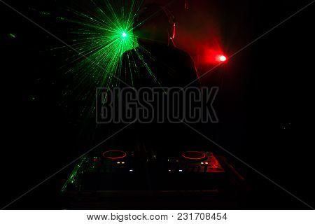 Dj Spinning, Mixing, And Scratching In A Night Club, Hands Of Dj Tweak Various Track Controls On Dj'