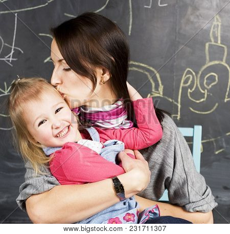 Cute Cheerful Teacher With Little Pupil In Classroom At Blackboard Learning, Happy Smiling, Lfestyle