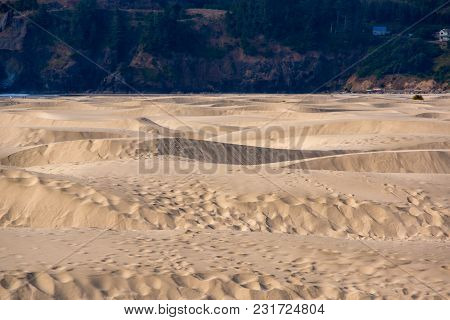 Waves Of Sand Piled Up On An Oregon Beach.