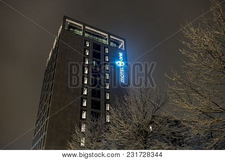 Munich , Germany - February 17 2018 : The Motel One Hotel Chain Logo Is Shining In The Night.