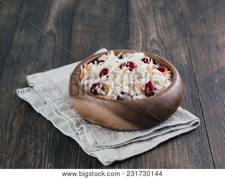 Traditional Russian Appetizer Sauerkraut With Cranberry And Carrot In Wooden Bowl On Brown Rustic Wo