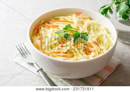 Fresh Coleslaw Salad In Bowl On Gray Stone Background.