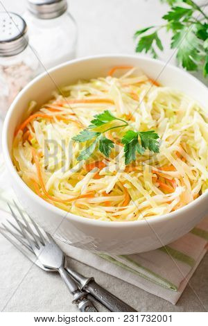 Fresh Coleslaw Salad In Bowl On Gray Stone Background.