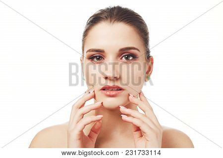 Indoor Shot Of Beautiful Adorable Female Model Demonstrates Soft Healthy Pure Skin After Spa Procedu