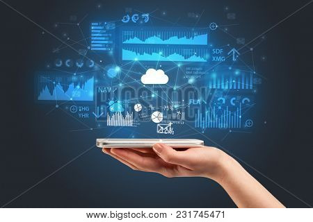 Businessman using phone with flying application icons around