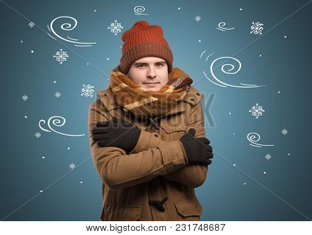 Young hipster frozen boy with doodled snowflakes and windy concept
