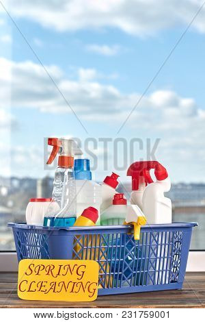 Cleaning Supplies Kit In Basket. House Cleaning Products On Blue Sky Background. Professional Cleani