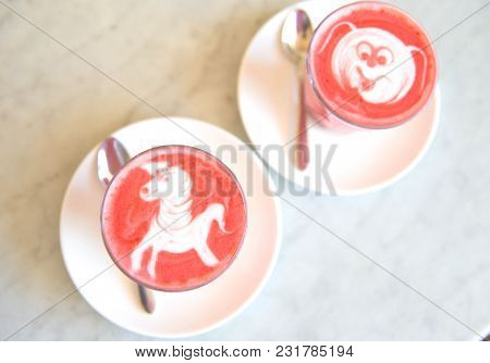 Beetroot Latte On Marble Background With Unicorn Art On The Top. Flat Lay View. Color Trendy Latte.