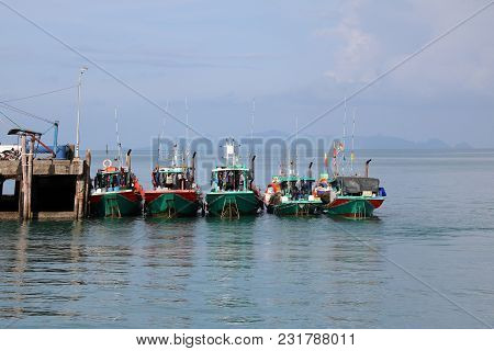 Local Fishing Boats Parked Together On The Pier,gulf Of Thailand