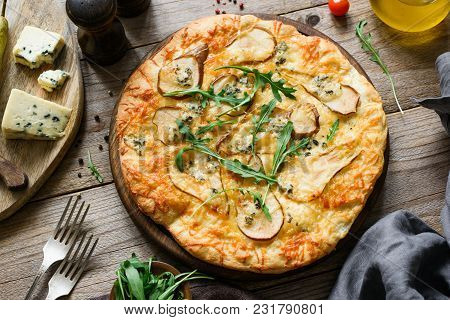Quatro Formaggi Pizza With Pear. Pear And Blue Cheese Pizza On Wooden Board Garnished With Arugula, 