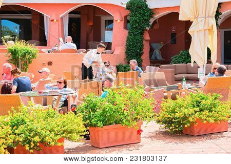 Porto Cervo, Italy - September 11, 2017: People At Street Cafe In Porto Cervo Resort, Costa Smeralda