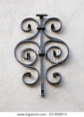 Medieval Ironcast Decoration On A White Wall In Tallinn