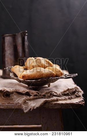 Hamantaschen Cookies With Poppy Seed And Risins And Icing Sugar On A Plate, Cooked For Jewish Festiv