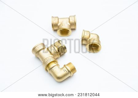 Various Plumbers Tools And Plumbing Materials Including Coper Pipe, Elbow Joint, Wrench And Spanner.