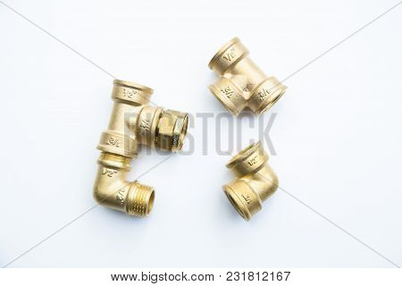 Various Plumbers Tools And Plumbing Materials Including Coper Pipe, Elbow Joint, Wrench And Spanner.