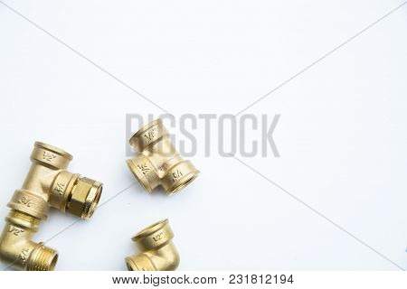 Various Plumbers Tools And Plumbing Materials Including Coper Pipe, Elbow Joint, Wrench And Spanner.