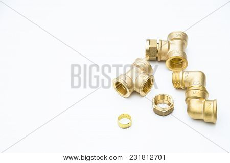 Various Plumbers Tools And Plumbing Materials Including Coper Pipe, Elbow Joint, Wrench And Spanner.