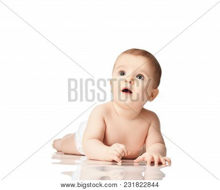 8 Month Infant Child Baby Boyl Toddler Lying Naked Looking At The Corner Isolated On A White Backgro