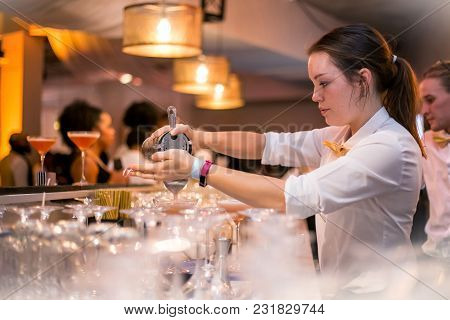 Johannesburg,south Africa-march 15, 2018: Barlady Pouring A Cocktail.