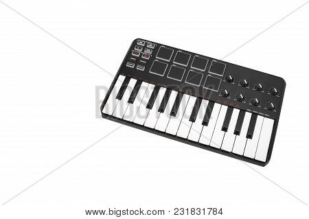 Musical Instrument - Sloseup Midi Piano Keyboard. It Is Isolated On A White Background