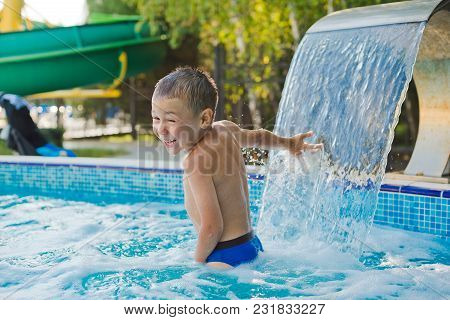 Child Is Playing In The Children's Pool